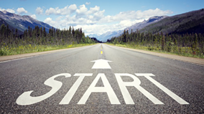 Start written on a road going into the mountains