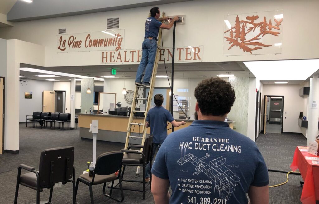 Man cleaning the duct